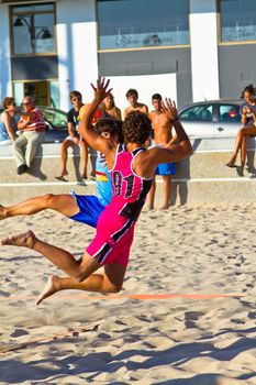 CADIZ, SPAIN - JULY 19: Unidentified players compete in a match between Zonabalonmano.com and CadizSur Seguros BMPY in the 19th league of beach handball of Cadiz on July 19, 2011 in Cadiz, Spain