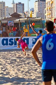 CADIZ, SPAIN - JULY 19: Unidentified players compete in a match between Zonabalonmano.com and CadizSur Seguros BMPY in the 19th league of beach handball of Cadiz on July 19, 2011 in Cadiz, Spain