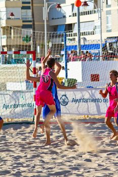 CADIZ, SPAIN - JULY 19: Unidentified players compete in a match between Zonabalonmano.com and CadizSur Seguros BMPY in the 19th league of beach handball of Cadiz on July 19, 2011 in Cadiz, Spain