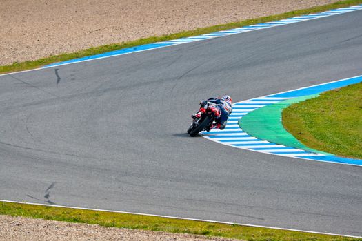 JEREZ DE LA FRONTERA, SPAIN - MAR 5:125cc pilot Danny Kent takes a curve on the official training of the world championship of MotoGP on Mar 5, 2011, in Jerez de la Frontera, Spain