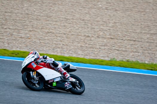 JEREZ DE LA FRONTERA, SPAIN - MAR 5: 125cc motorcyclist Louis Rossi races on the official training of the world championship of MotoGP on March 5, 2011 in Jerez de la Frontera, Spain