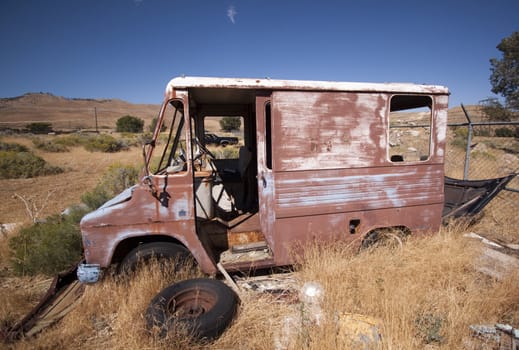 An old rusty abandoned car.