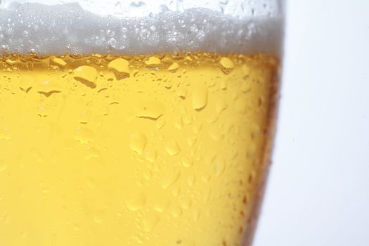 Detail of a beer in a glass with foam