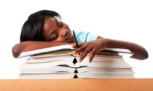Student tired of doing homework studying with pen laying unmotivated on stack open books, isolated.