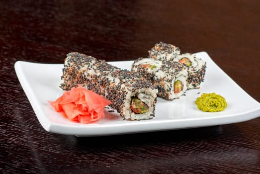 Closeup of Sushi rolls at plate with sesame