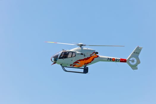 CADIZ, SPAIN-SEP 12: Helicopters of the Patrulla Aspa taking part in an exhibition on the 3rd airshow of Cadiz on Sep 12, 2010, in Cadiz, Spain