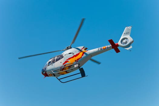 CADIZ, SPAIN-SEP 12: Helicopters of the Patrulla Aspa taking part in an exhibition on the 3rd airshow of Cadiz on Sep 12, 2010, in Cadiz, Spain
