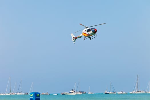 CADIZ, SPAIN-SEP 12: Helicopters of the Patrulla Aspa taking part in an exhibition on the 3rd airshow of Cadiz on Sep 12, 2010, in Cadiz, Spain