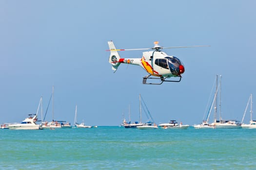 CADIZ, SPAIN-SEP 12: Helicopters of the Patrulla Aspa taking part in an exhibition on the 3rd airshow of Cadiz on Sep 12, 2010, in Cadiz, Spain