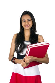 Young teenage girl holding books. Isolated on a white background.