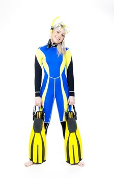 standing young woman wearing neoprene with snorkeling equipment