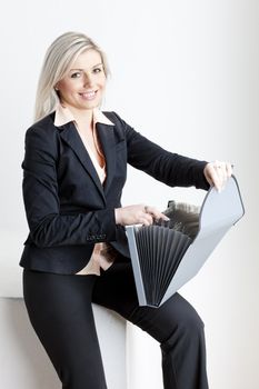 portrait of young businesswoman with folders