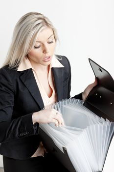 portrait of young businesswoman with folders