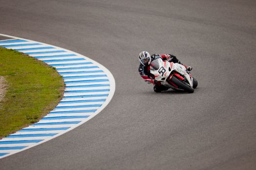 JEREZ DE LA FRONTERA, SPAIN - NOV 20: Stock Extreme motorcyclist Diego Lopez takes a curve in the CEV championship on Nov 20, 2010, in Jerez de la Frontera, Spain