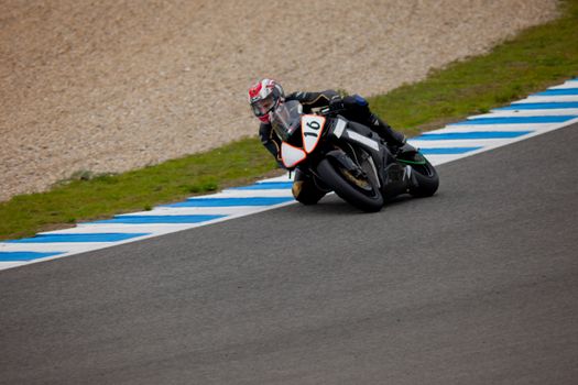 JEREZ DE LA FRONTERA, SPAIN - NOV 20: Stock Extreme motorcyclist Raffaele Mattiello takes a curve in the CEV championship on Nov 20, 2010, in Jerez de la Frontera, Spain