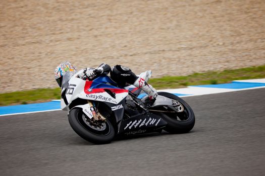 JEREZ DE LA FRONTERA, SPAIN - NOV 20: Stock Extreme motorcyclist Eduardo Salvador takes a curve in the CEV championship on Nov 20, 2010, in Jerez de la Frontera, Spain
