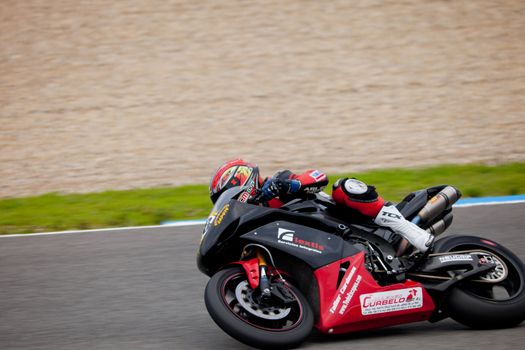 JEREZ DE LA FRONTERA, SPAIN - NOV 20: Stock Extreme motorcyclist Raul Garcia takes a curve in the CEV championship on Nov 20, 2010, in Jerez de la Frontera, Spain
