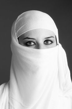 Arab woman wearing a soft veil. Black and white