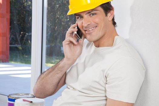 Portrait of construction worker talking on phone