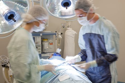 Medical doctor performing an operation in operating room