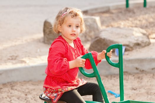 Having fun at playground in the park on Sunday afternoon.