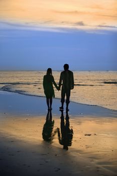 Couple on sunset. Coast of the Indian ocean