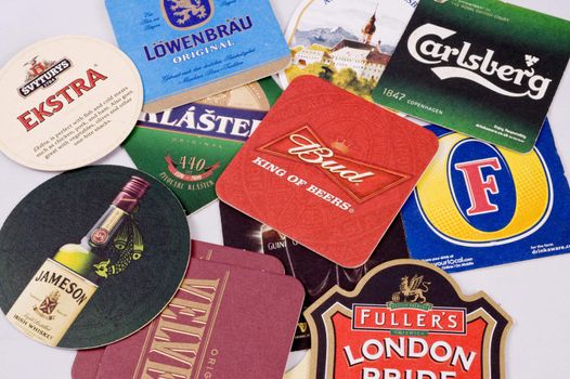 Beer coasters of differenet beer trademarks taken as macro