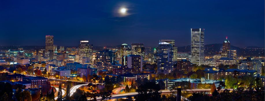 Moon Rise Over Portland Oregon City Skyline and Light Trails at Blue Hour