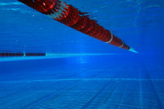 underwater view from a swimming pool with red marking