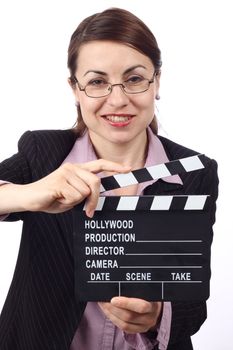 Young smiling woman holding movie clapper