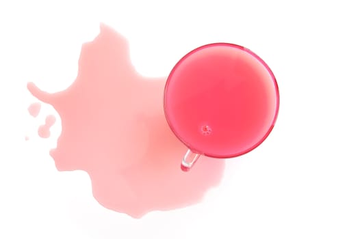 Pink drink from whey and juice in a glass cup on the table isolated on a white background