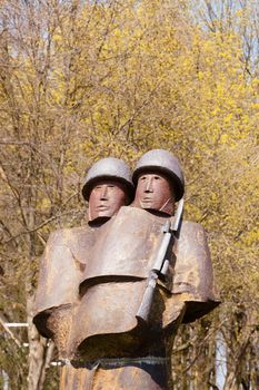 Metal sculptures of soldiers next to Kolobrzeg Promenade.