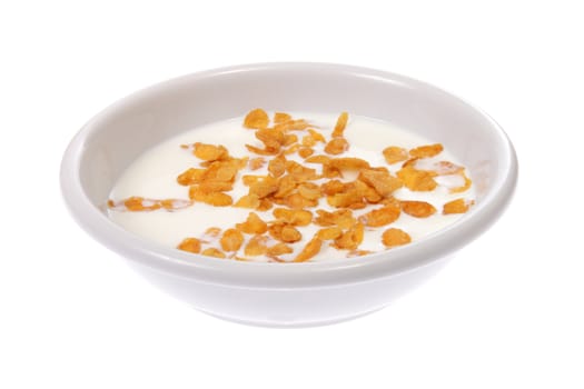 Bowl with corn flakes and milk, photo on white