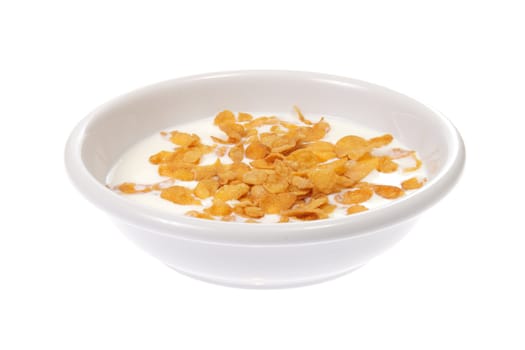 Bowl with corn flakes and milk, photo on white