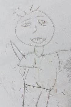 Drawing on sand on a theme of rest,Shaped like a man