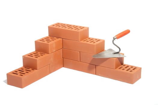 red bricks and trowel, photo on the white background