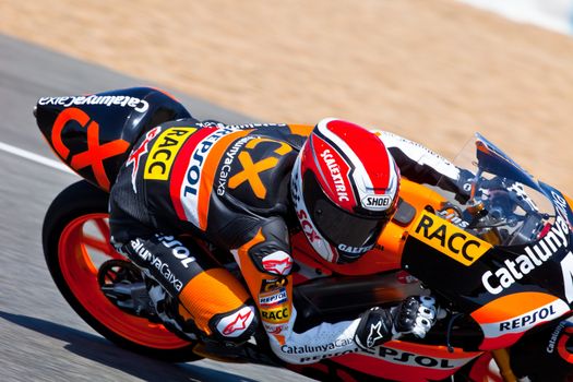 JEREZ DE LA FRONTERA, SPAIN - APR 17: 125cc motorcyclist Alex Rins takes a curve in the CEV Championship race on April 17, 2011 in Jerez de la Frontera, Spain.
