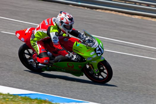 JEREZ DE LA FRONTERA, SPAIN - APR 17: 125cc motorcyclist Juanfran Guevara takes a curve in the CEV Championship race on April 17, 2011 in Jerez de la Frontera, Spain.
