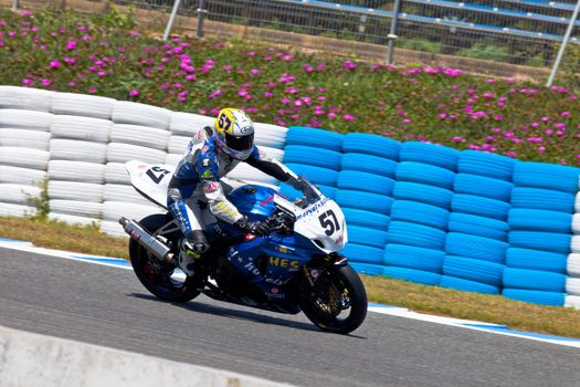 JEREZ DE LA FRONTERA, SPAIN - APR 17: Stock Extreme motorcyclist Ferran Casas takes a curve in the CEV Championship race on April 17, 2011 in Jerez de la Frontera, Spain