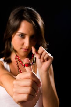 Beautiful Hispanic girl playing with her necklace