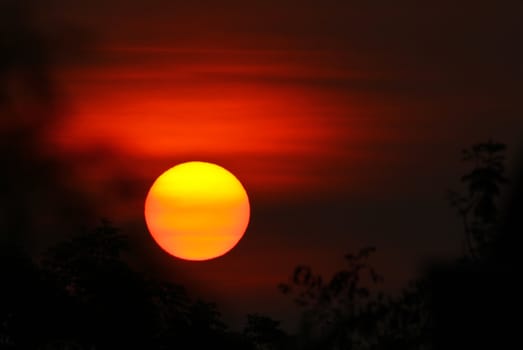 One red morning with the sun just rose over the mountains