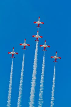 CADIZ, SPAIN-SEP 9: Aircrafts of the Patrulla Aguila taking part in a test on the 4th airshow of Cadiz on Sep 9, 2011, in Cadiz, Spain