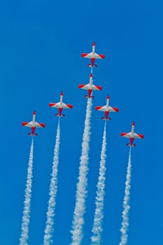 CADIZ, SPAIN-SEP 9: Aircrafts of the Patrulla Aguila taking part in a test on the 4th airshow of Cadiz on Sep 9, 2011, in Cadiz, Spain