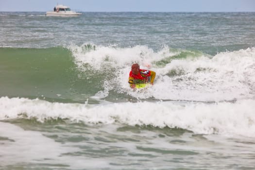 SAN FERNANDO, CADIZ, SPAIN - FEB 19: Unknown bodyboader going to the water on the 2nd championship of Surf and BodyBoard Impoxibol on Feb 19,2011 on the beach of Camposoto of San Fernando, Cadiz, Spain