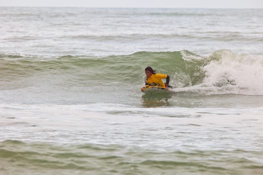 SAN FERNANDO, CADIZ, SPAIN - FEB 19: Unknown bodyboader going to the water on the 2nd championship of Surf and BodyBoard Impoxibol on Feb 19,2011 on the beach of Camposoto of San Fernando, Cadiz, Spain