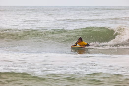 SAN FERNANDO, CADIZ, SPAIN - FEB 19: Unknown bodyboader going to the water on the 2nd championship of Surf and BodyBoard Impoxibol on Feb 19,2011 on the beach of Camposoto of San Fernando, Cadiz, Spain