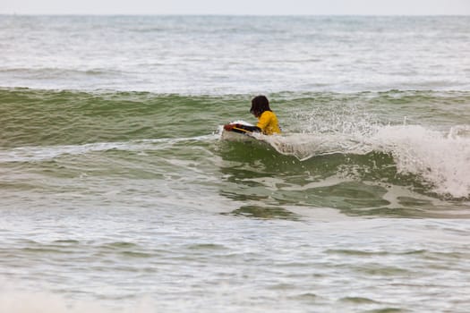 SAN FERNANDO, CADIZ, SPAIN - FEB 19: Unknown bodyboader going to the water on the 2nd championship of Surf and BodyBoard Impoxibol on Feb 19,2011 on the beach of Camposoto of San Fernando, Cadiz, Spain