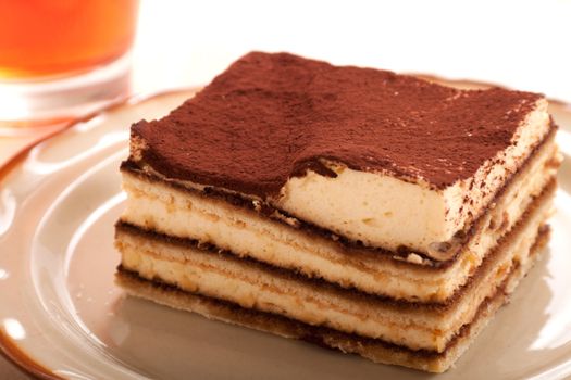 Portion of self-made tiramisu dessert served on a plate 