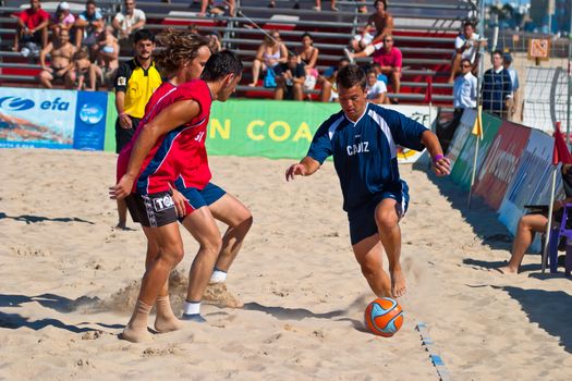 CADIZ, SPAIN -  JUL 30:  Unknown players of the team of Cadiz and Gijon playing the Spanish Championship of Beach Soccer on Jul 30, 2005 on the beach of La Victoria in Cadiz, Spain