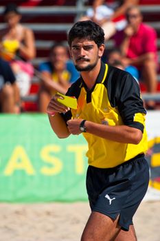 CADIZ, SPAIN -  JUL 30:  Unknown referee,  refereeing a match of the Spanish Championship of Beach Soccer on Jul 30, 2005 on the beach of La Victoria in Cadiz, Spain